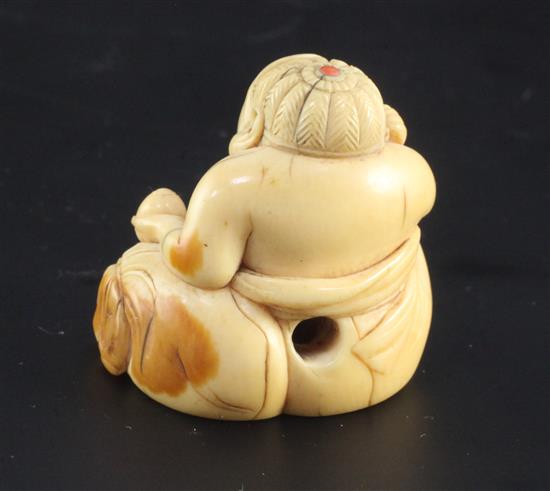 A Japanese ivory seated figure of Hotei, 18th / 19th century, height 3.2cm